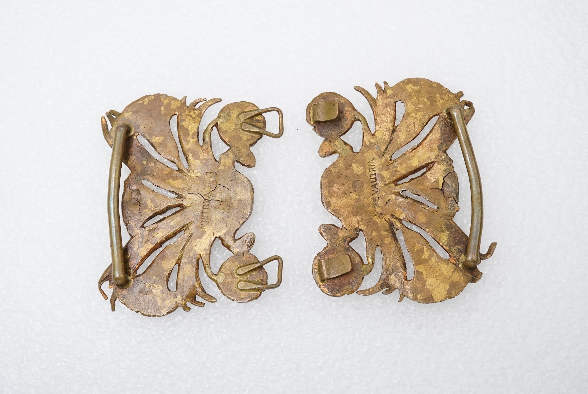 Line Vautrin, a gilt bronze belt buckle